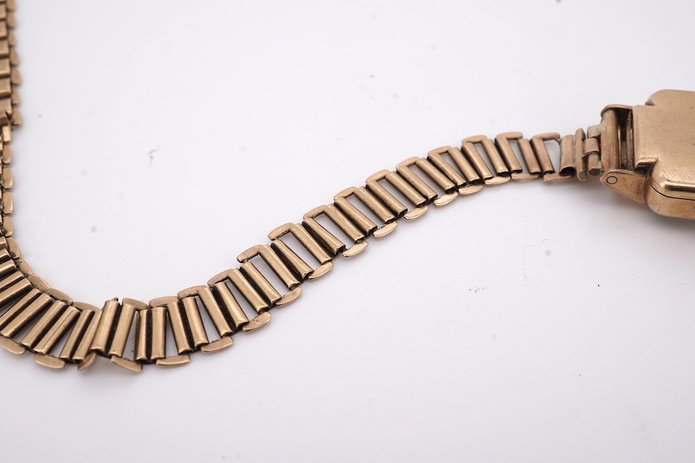 A lady's 1950's 9ct gold Tudor manual wind wrist watch, with Arabic dial, case diameter 18mm, on a damaged 9ct gold bracelet, gross weight 18.6 grams, together with a lady's 18ct gold Buren manual wind wrist watch, on a